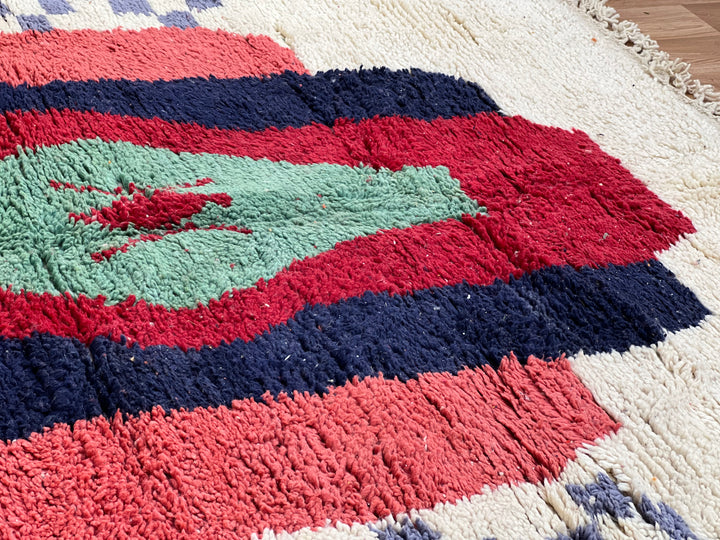 Vintage Moroccan Berber rug with green lozenge and colorful geometric pattern, handmade from wool. Perfect for adding bold character.
