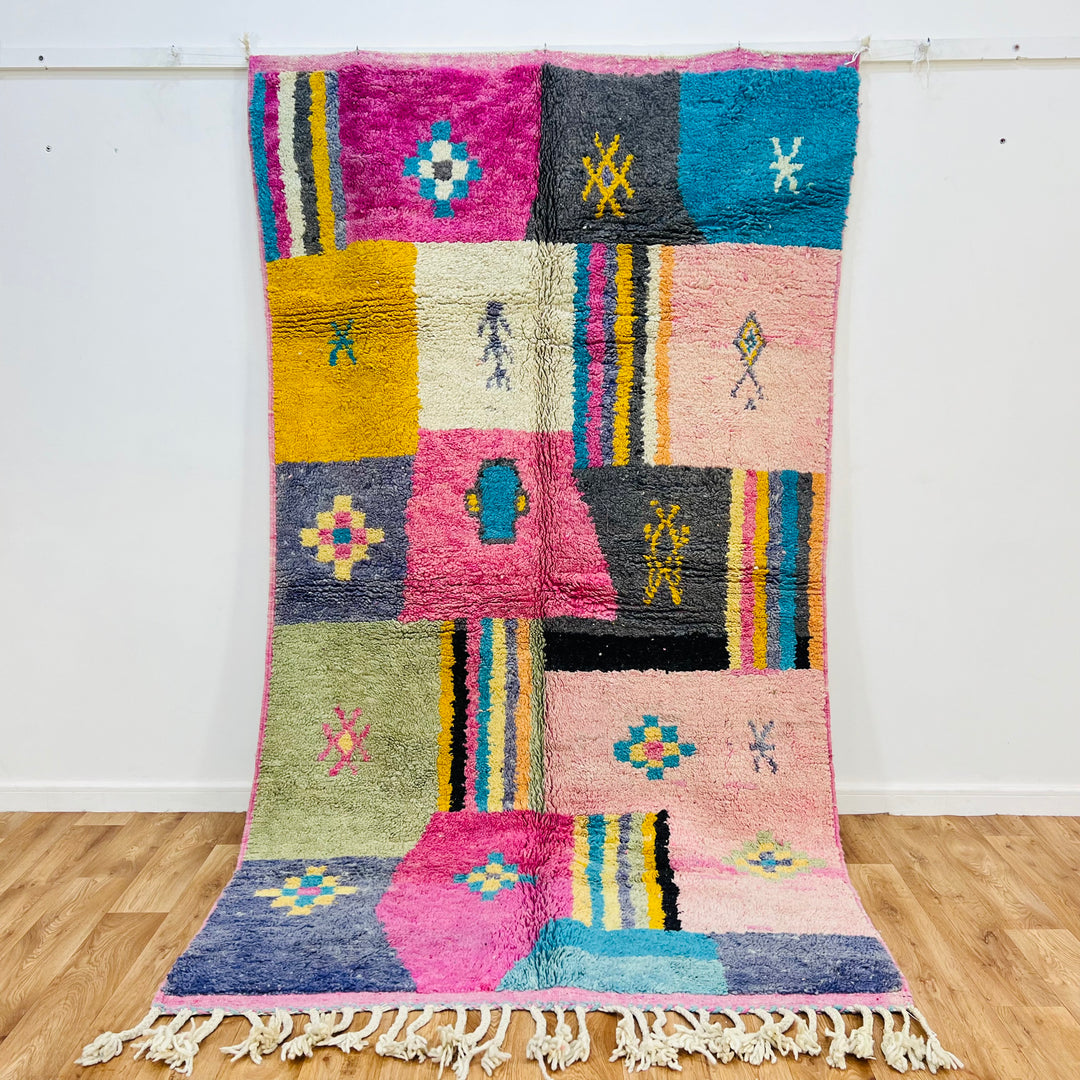 Colorful vintage Moroccan Berber rug 8.7x5 ft, wool patchwork design, vibrant tribal patterns, handmade in the Atlas Mountains.