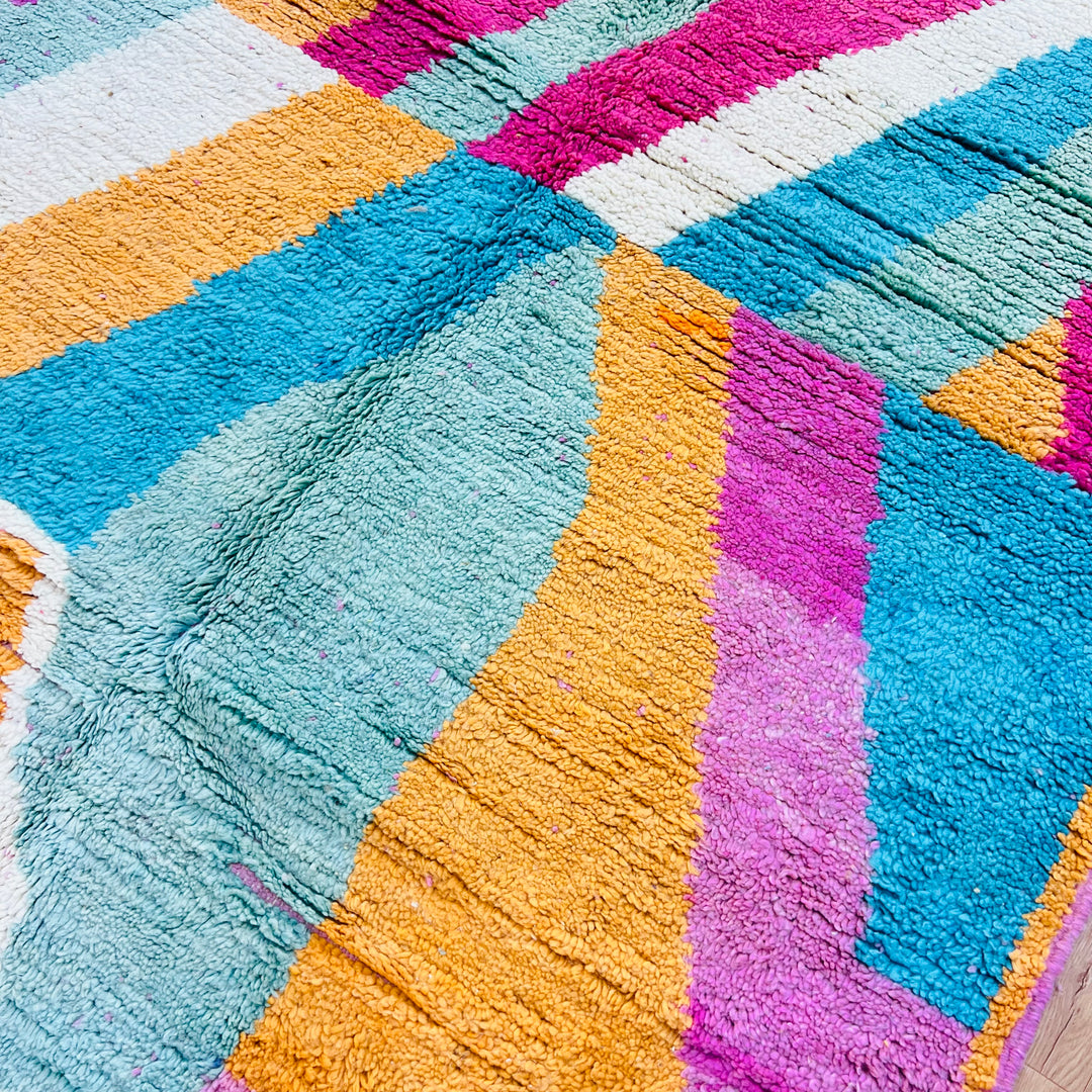 Colorful handmade vintage Moroccan rug with zigzag pattern in orange, teal, fuchsia, cream, and black. Perfect as an 8x5 ft area rug.