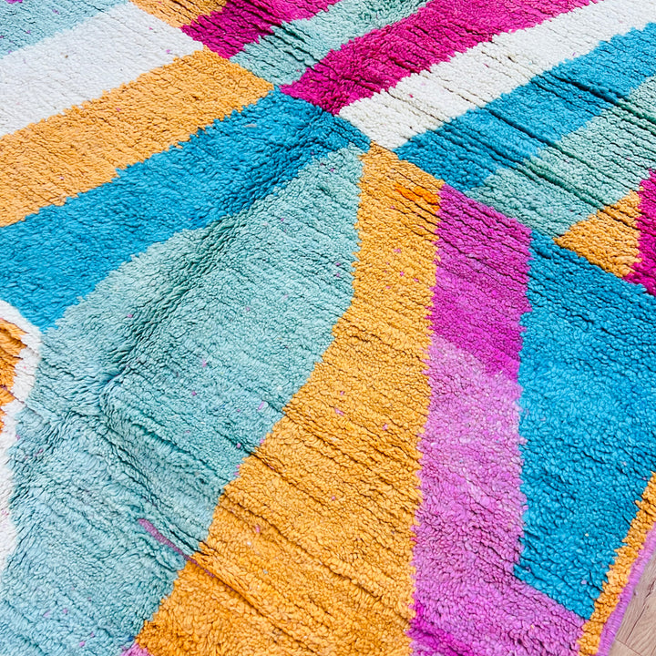 Colorful handmade vintage Moroccan rug with zigzag pattern in orange, teal, fuchsia, cream, and black. Perfect as an 8x5 ft area rug.