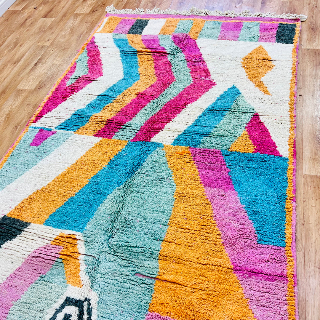 Vintage Moroccan rug with bold zigzag and abstract patterns in orange, teal, pink, and cream, handmade wool 8.3x5 ft area rug