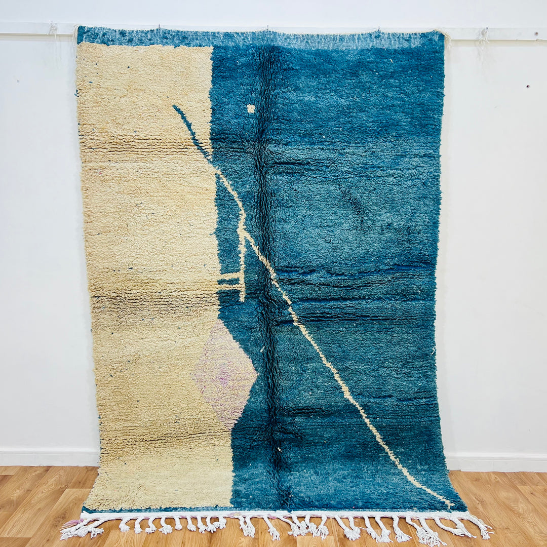 Vintage Moroccan rug 8x5 ft, blue and cream minimal design, handwoven by Berber women. Perfect for modern interiors, 100% wool.
