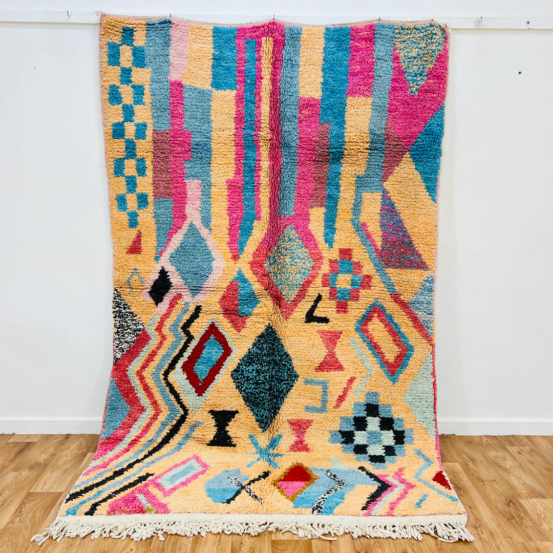 Vintage Moroccan Berber rug in pink and turquoise with diamond and tribal patterns, handcrafted wool, 8.5x5.3ft. Perfect boho decor.