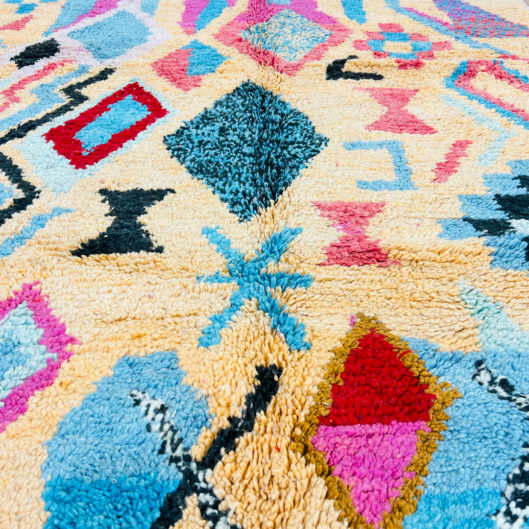 Vintage Moroccan Rug with pink and turquoise diamond motifs, handcrafted in wool, perfect as a boho area rug or statement piece.