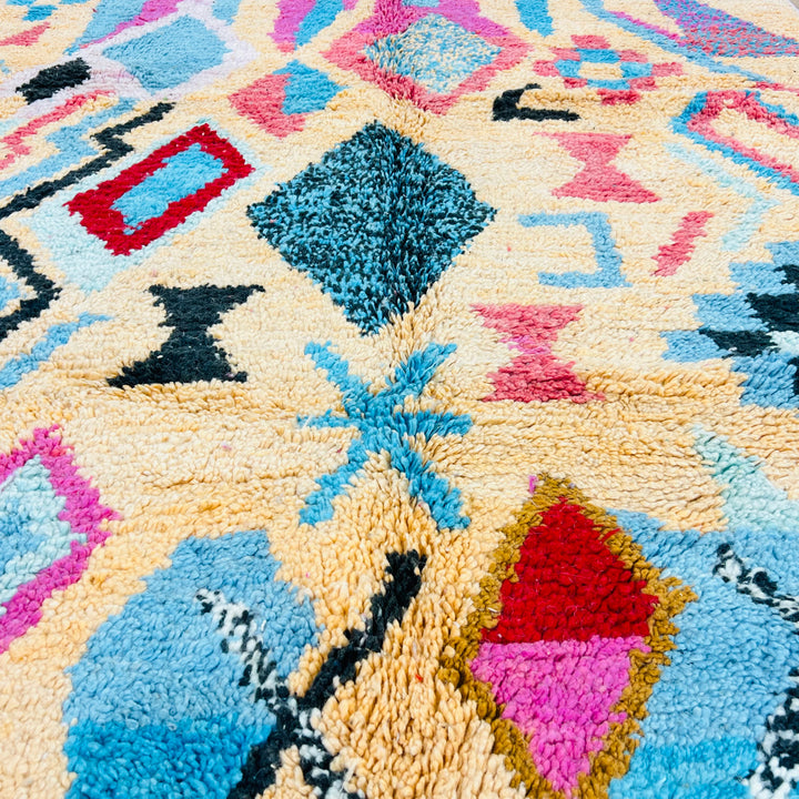 Vintage Moroccan Rug with pink and turquoise diamond motifs, handcrafted in wool, perfect as a boho area rug or statement piece.