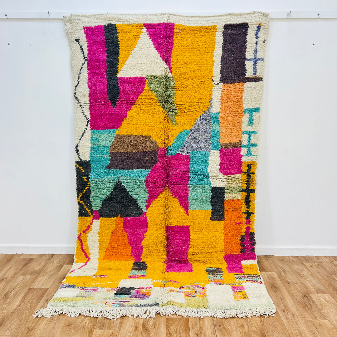 Vintage Moroccan abstract rug 8.56x5.02 ft with magenta, mustard, and teal patterns. Handwoven Moroccan wool rug for sale.