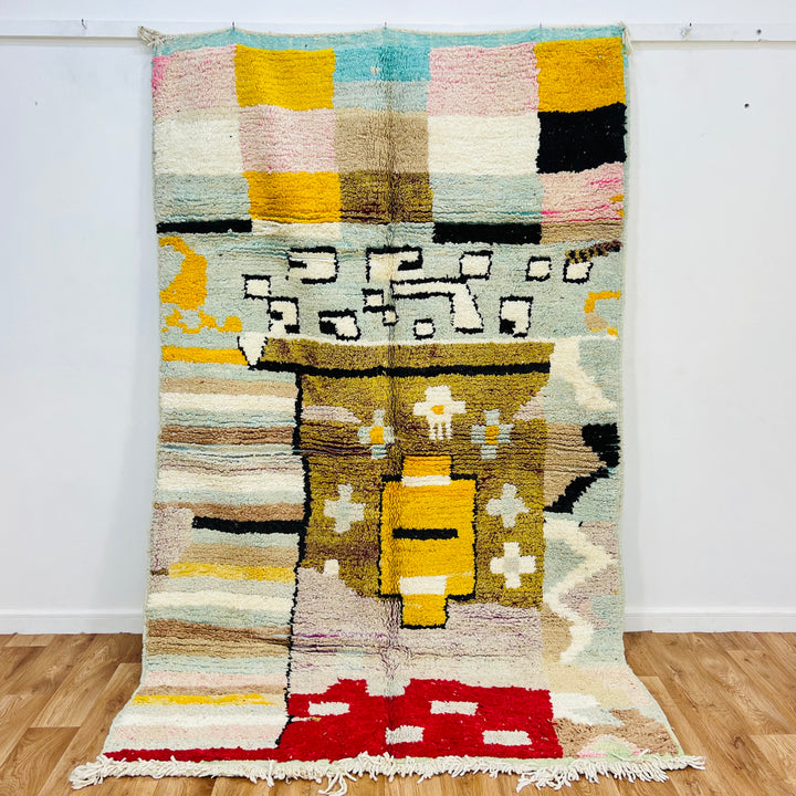 Colorful vintage Moroccan rug with abstract tribal motifs, handcrafted by Berber artisans. Features bold patterns in various colors.