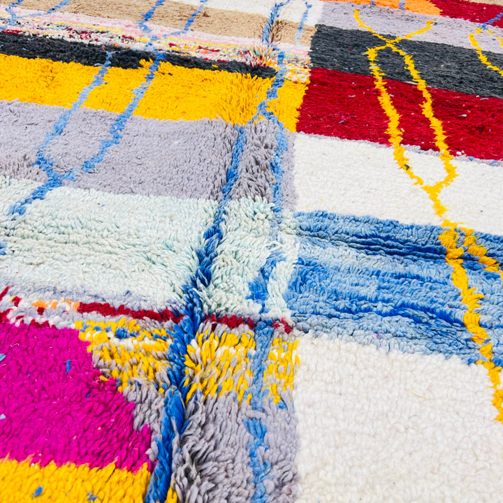 Colorful vintage Moroccan Berber rug with vibrant blocks and diamond motifs, handwoven in soft wool. Perfect for eclectic spaces.