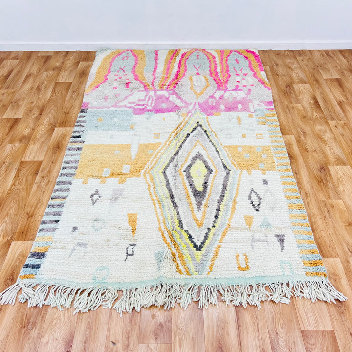 Vintage Moroccan rug with colorful diamond pattern, size 8x5 ft. Featuring pink, gold, gray tribal motifs. Handmade wool rug.