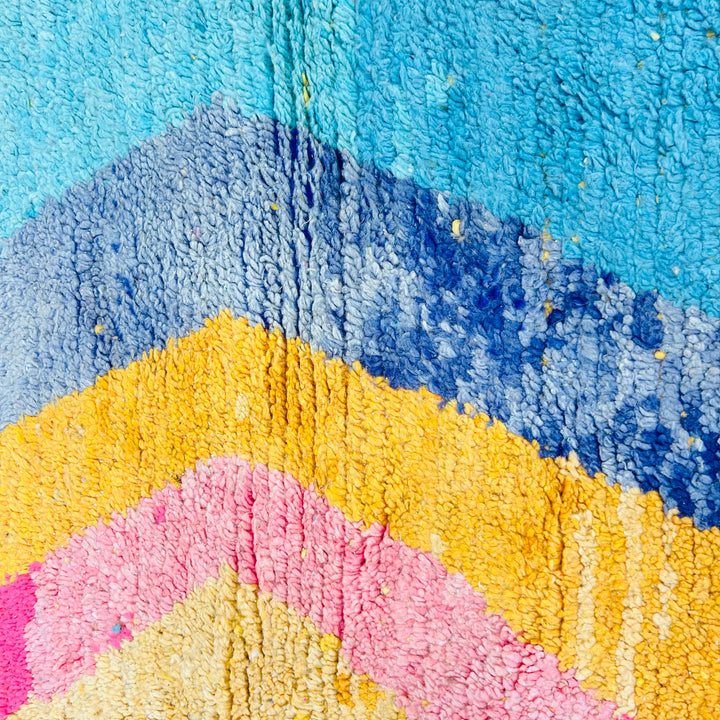 Vintage Moroccan shag rug with vibrant zigzag patterns in turquoise, pink, mustard, and navy. Handmade wool rug, 258 x 152 cm.
