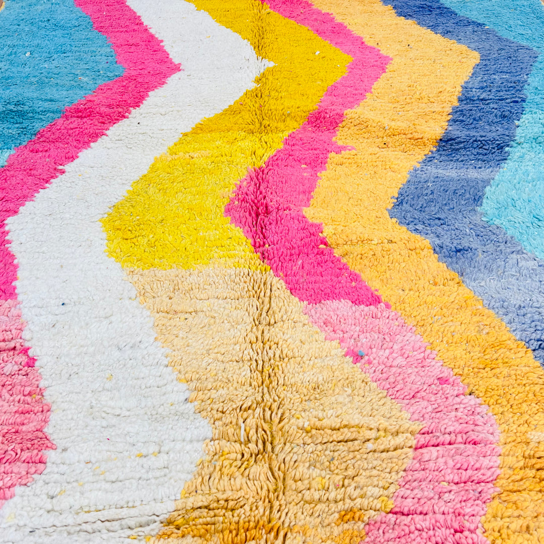 Colorful Moroccan shag rug with zigzag patterns in turquoise, pink, mustard, cream, and navy. Handmade, 100% wool, 8.5 x 5 ft.