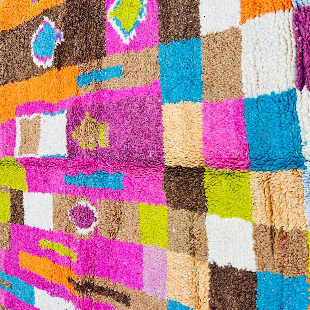 Bright vintage Moroccan rug with pink, orange, teal, and cream Berber patterns, handwoven in wool, size 8.1 x 5.2 ft.