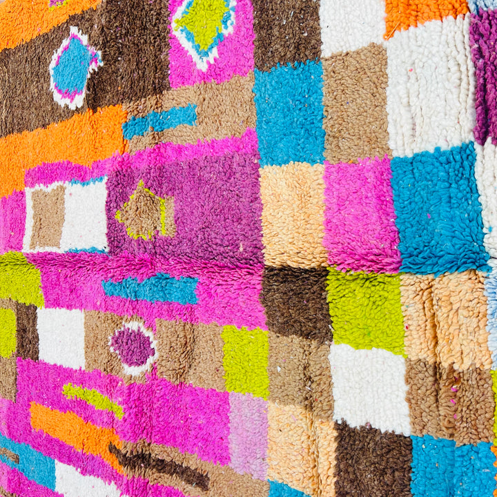 Bright vintage Moroccan rug with pink, orange, teal, and cream Berber patterns, handwoven in wool, size 8.1 x 5.2 ft.