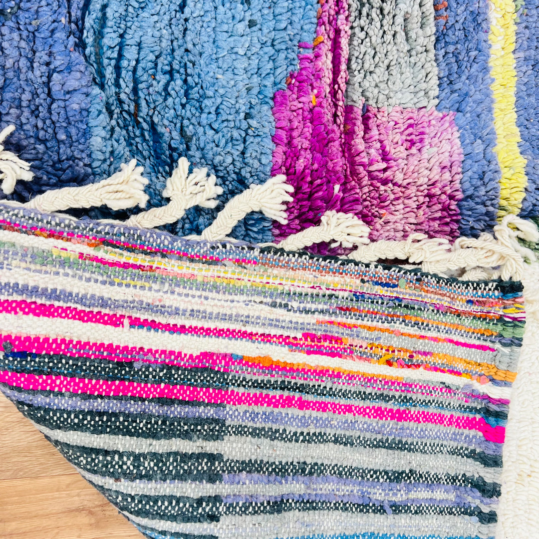 Vintage Moroccan rug with colorful abstract blocks in blue, purple, and pink. Handwoven wool design, ideal for bold interiors.