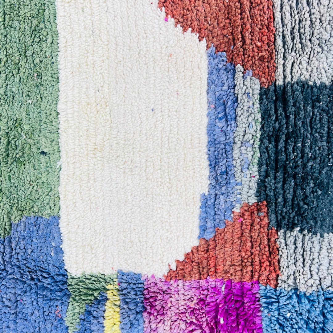 Color block vintage Moroccan rug with green, purple, yellow, cream, blue, and burgundy, handwoven by Berber artisans.