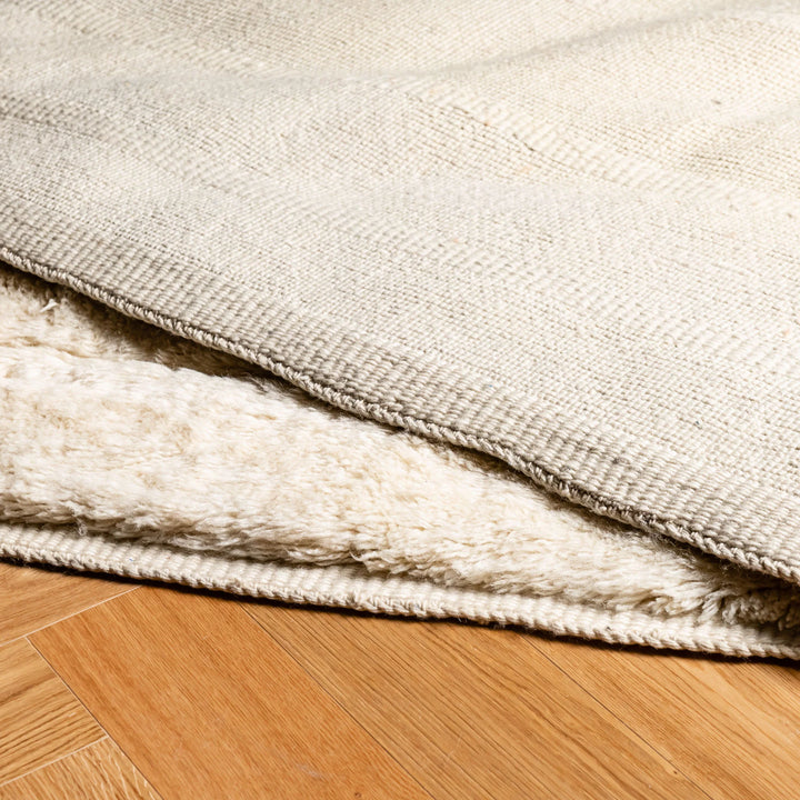 Ivory Beni Mrirt Moroccan wool rug with minimalist design, ideal for Scandinavian or Japandi-inspired interiors.