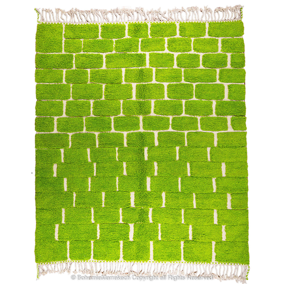 Handmade Moroccan rug in green checkered brick design, crafted from soft wool by Berber artisans