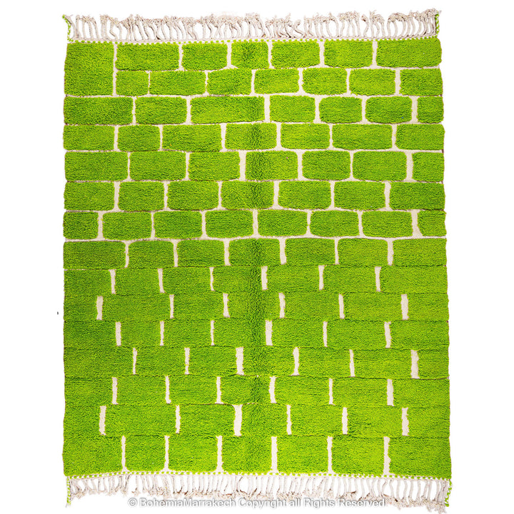 Handmade Moroccan rug in green checkered brick design, crafted from soft wool by Berber artisans