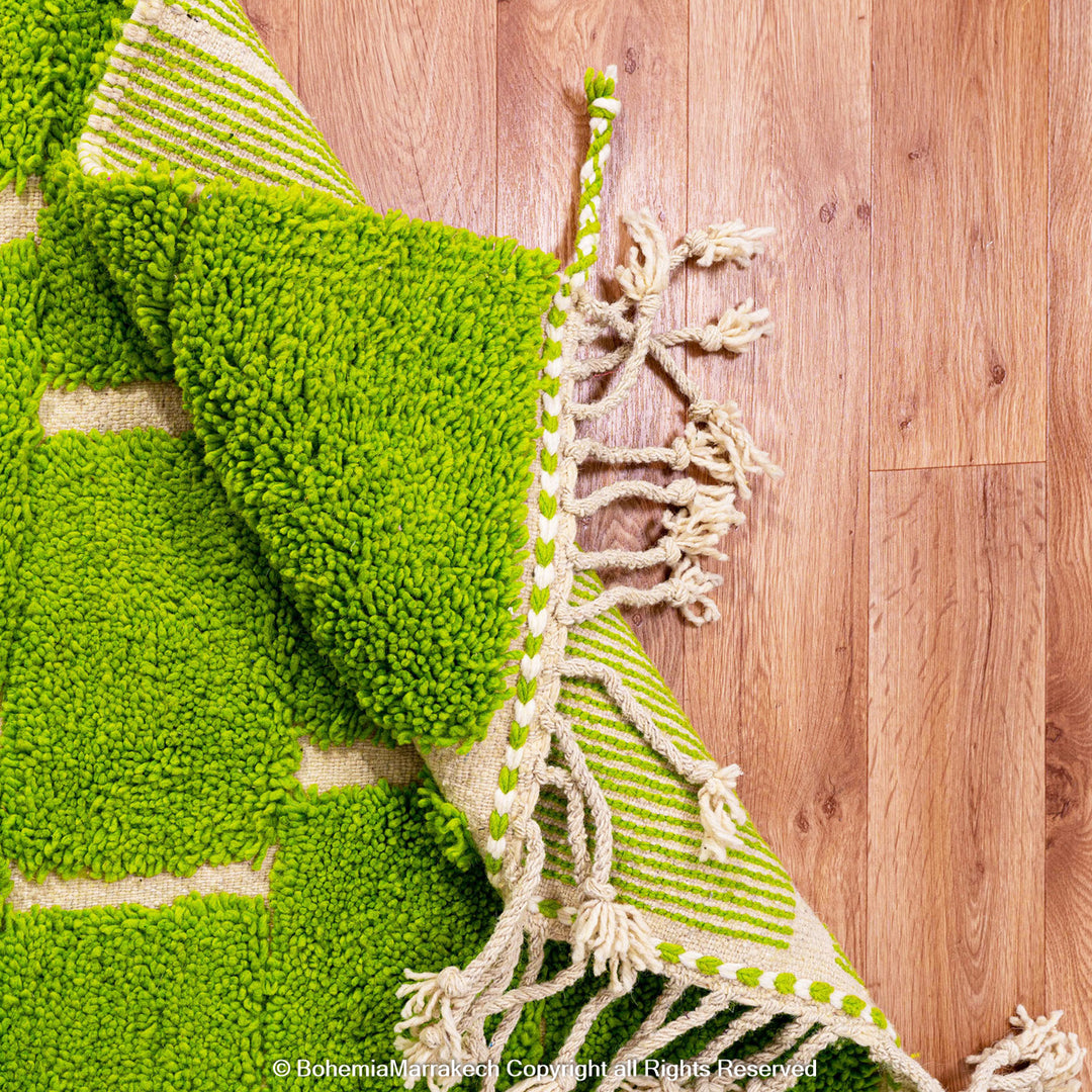 Handmade Moroccan rug in green checkered brick design, crafted from soft wool by Berber artisans