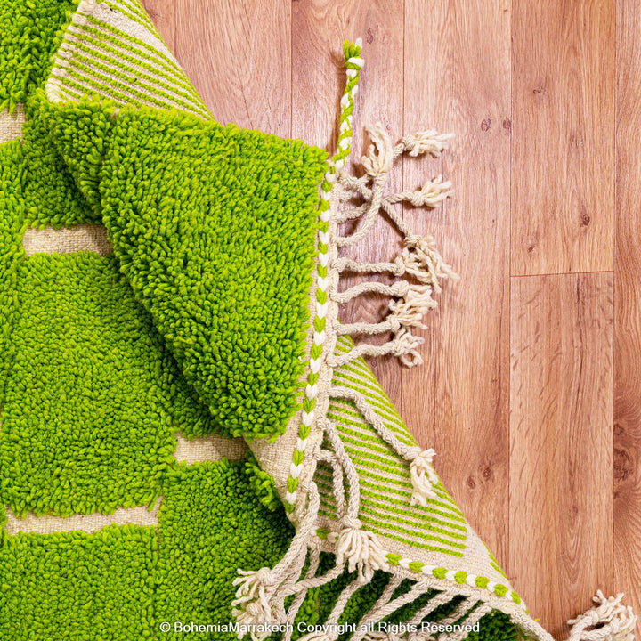 Handmade Moroccan rug in green checkered brick design, crafted from soft wool by Berber artisans