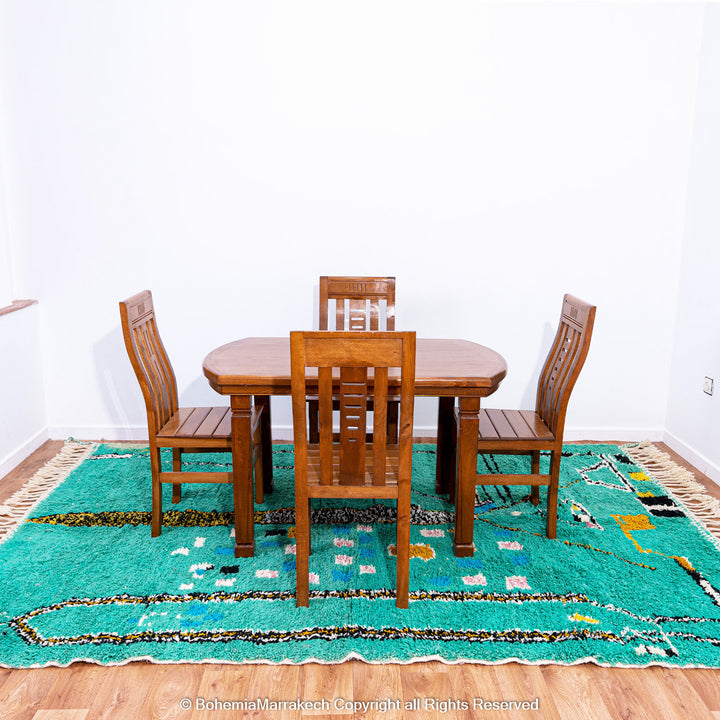 Handwoven green Moroccan Boujad rug with abstract Berber lines and colorful wool symbols