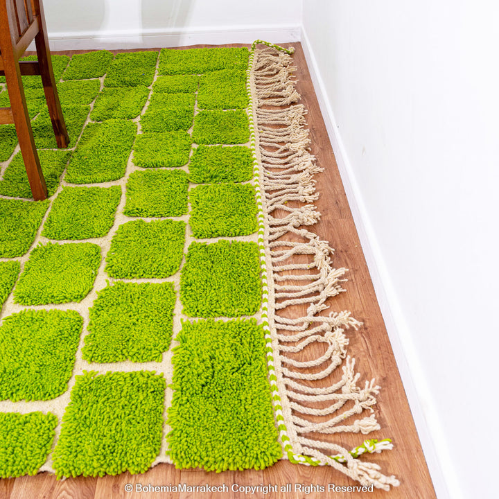 Handmade Moroccan rug in green checkered brick design, crafted from soft wool by Berber artisans