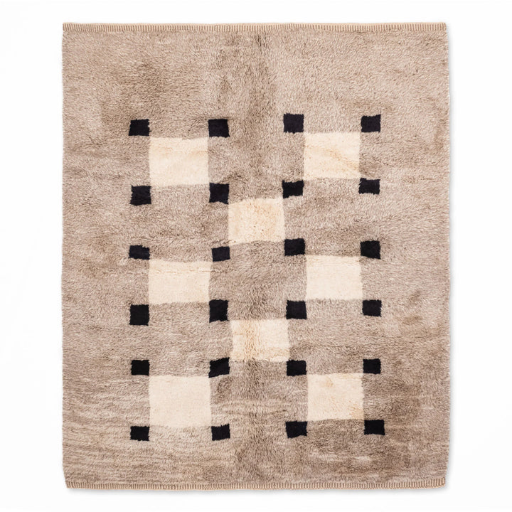 Minimalist Checkered Moroccan Rug, handwoven wool carpet, modern Berber design, black and white geometric pattern, traditional Moroccan style.