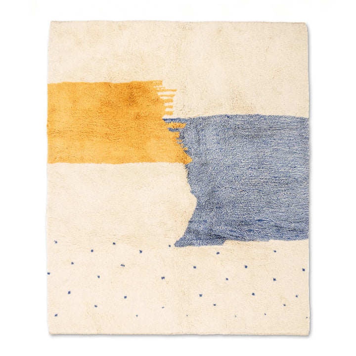 Modern abstract Moroccan wool rug in yellow, blue, and cream with brushstroke design, handcrafted for artistic flair.