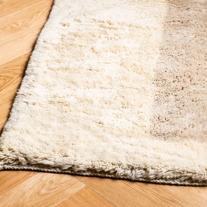 Natural wool Moroccan shag rug with plush texture on wooden floor, perfect for contemporary home decor.