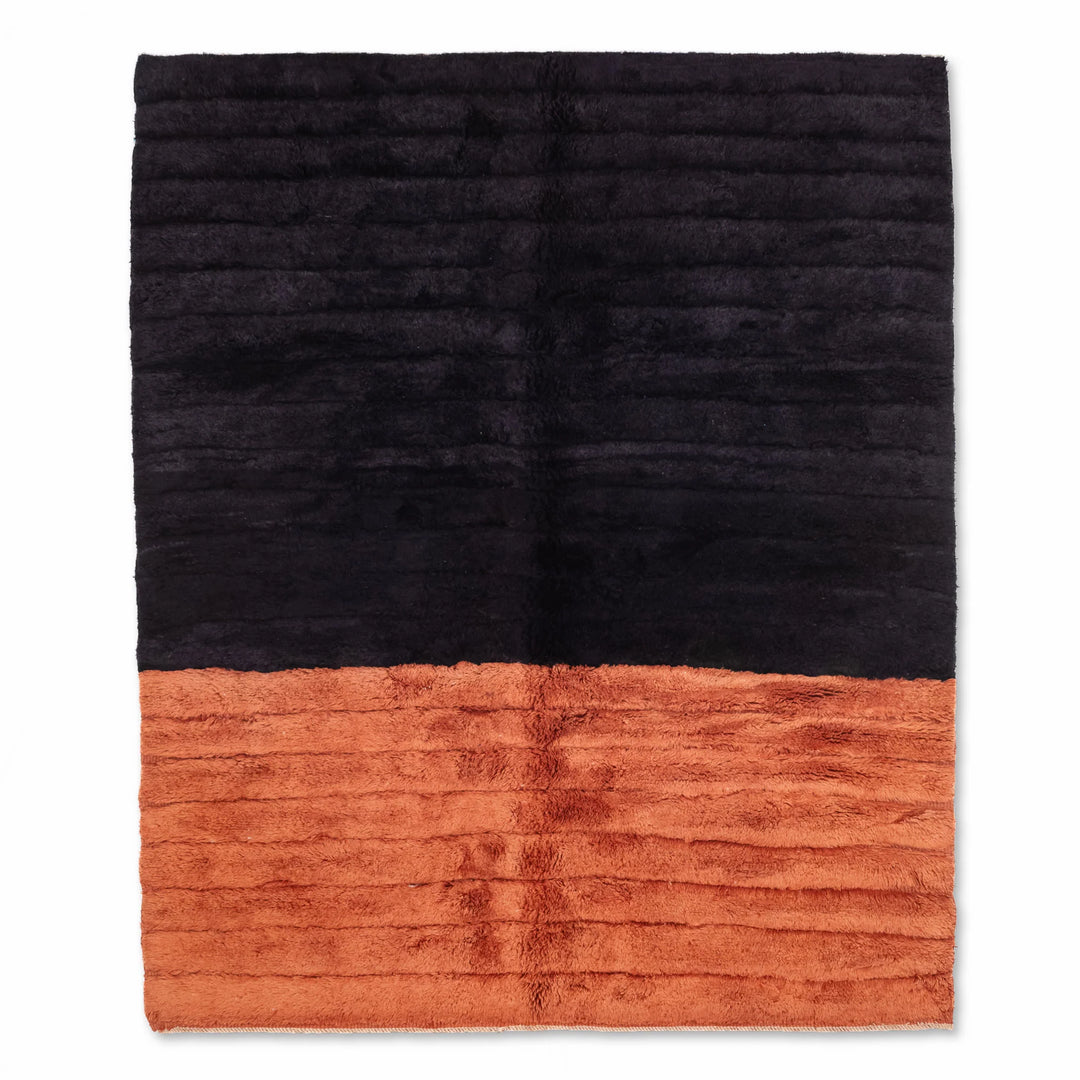 Modern black and rust Beni Mrirt wool rug, handmade in Morocco, featuring a sleek two-tone design, ideal for contemporary decor.