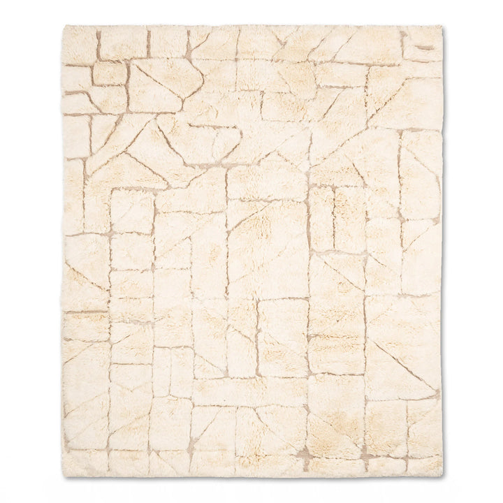 Modern cream Moroccan rug with geometric patterns, soft plush texture, made of natural wool, perfect for living rooms or bedrooms.