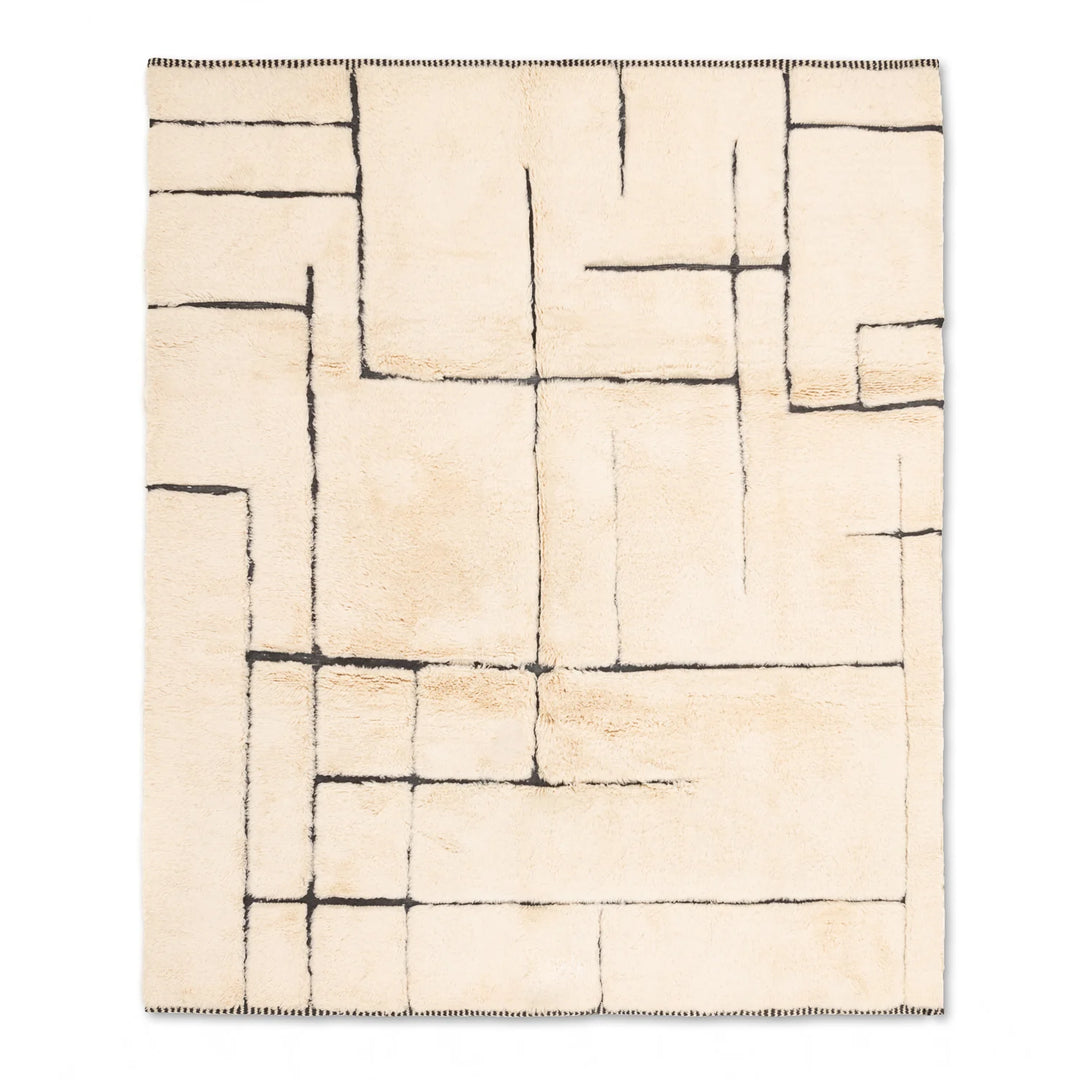 Modern ivory and black Moroccan wool rug with broken grid pattern, handcrafted by Berber artisans. Ideal for contemporary interiors.