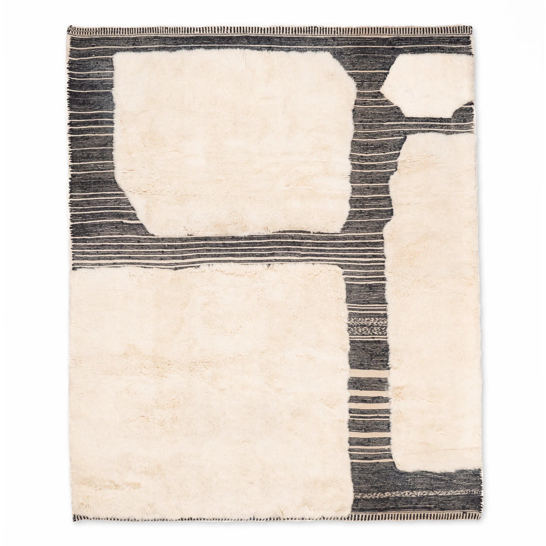 Modern Moroccan wool rug with handwoven abstract design by Berber artisans, perfect for contemporary interiors.