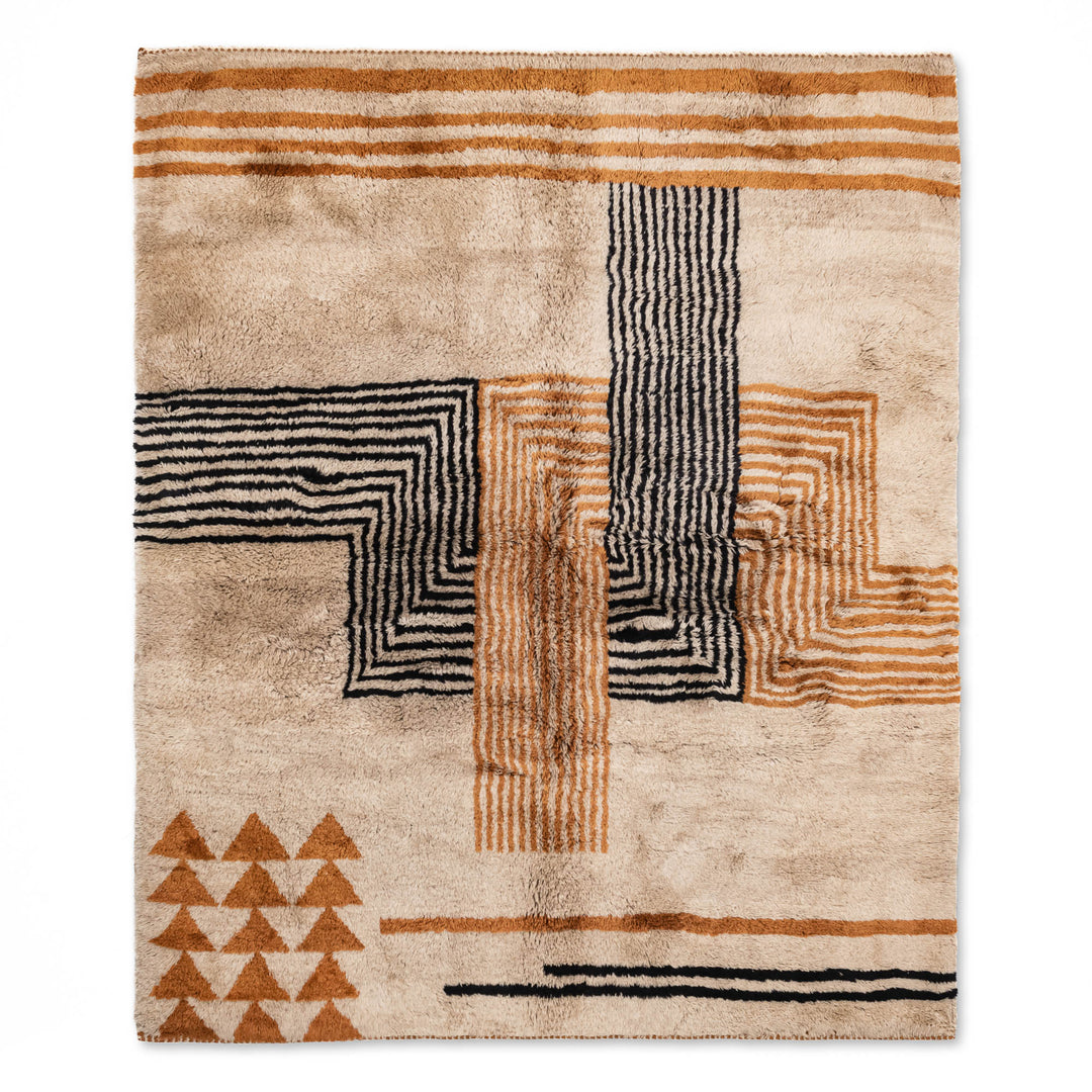 Modern Tribal Beni Mrirt Rug with abstract black Berber symbols on plush beige wool, handmade in Morocco by artisans.