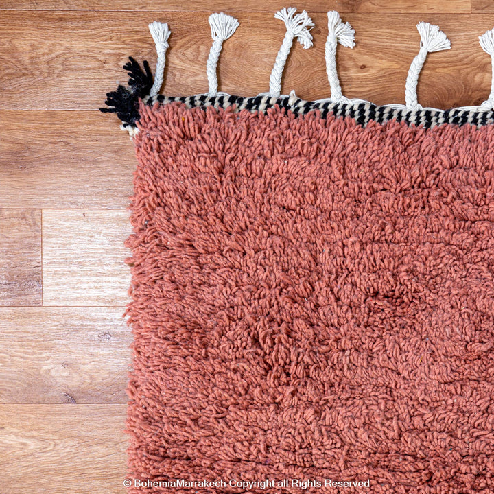 Colorful Moroccan Beni Ourain rug with diamond patterns, handmade from wool by Berber women