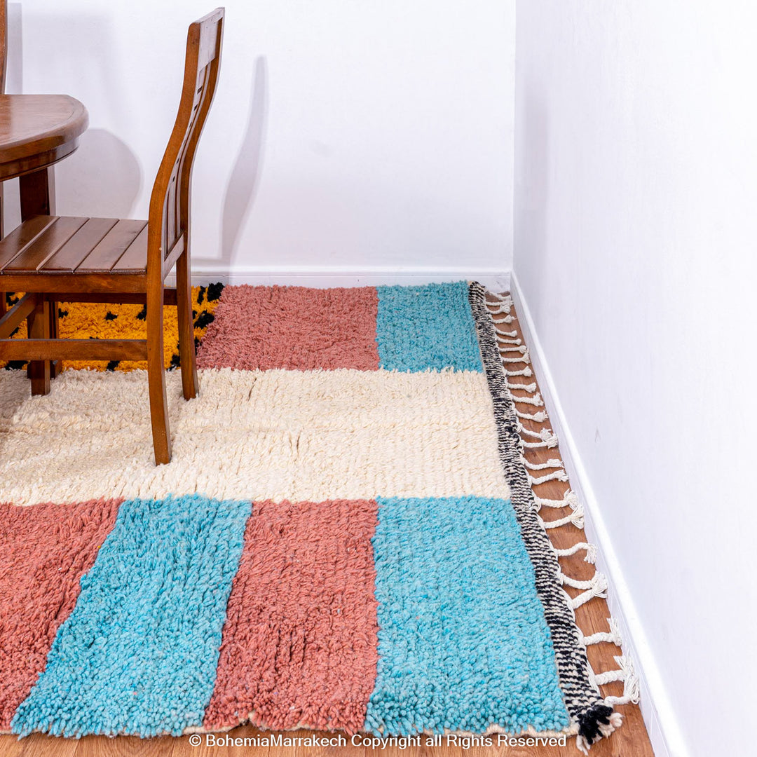 Colorful Moroccan Beni Ourain rug with diamond patterns, handmade from wool by Berber women