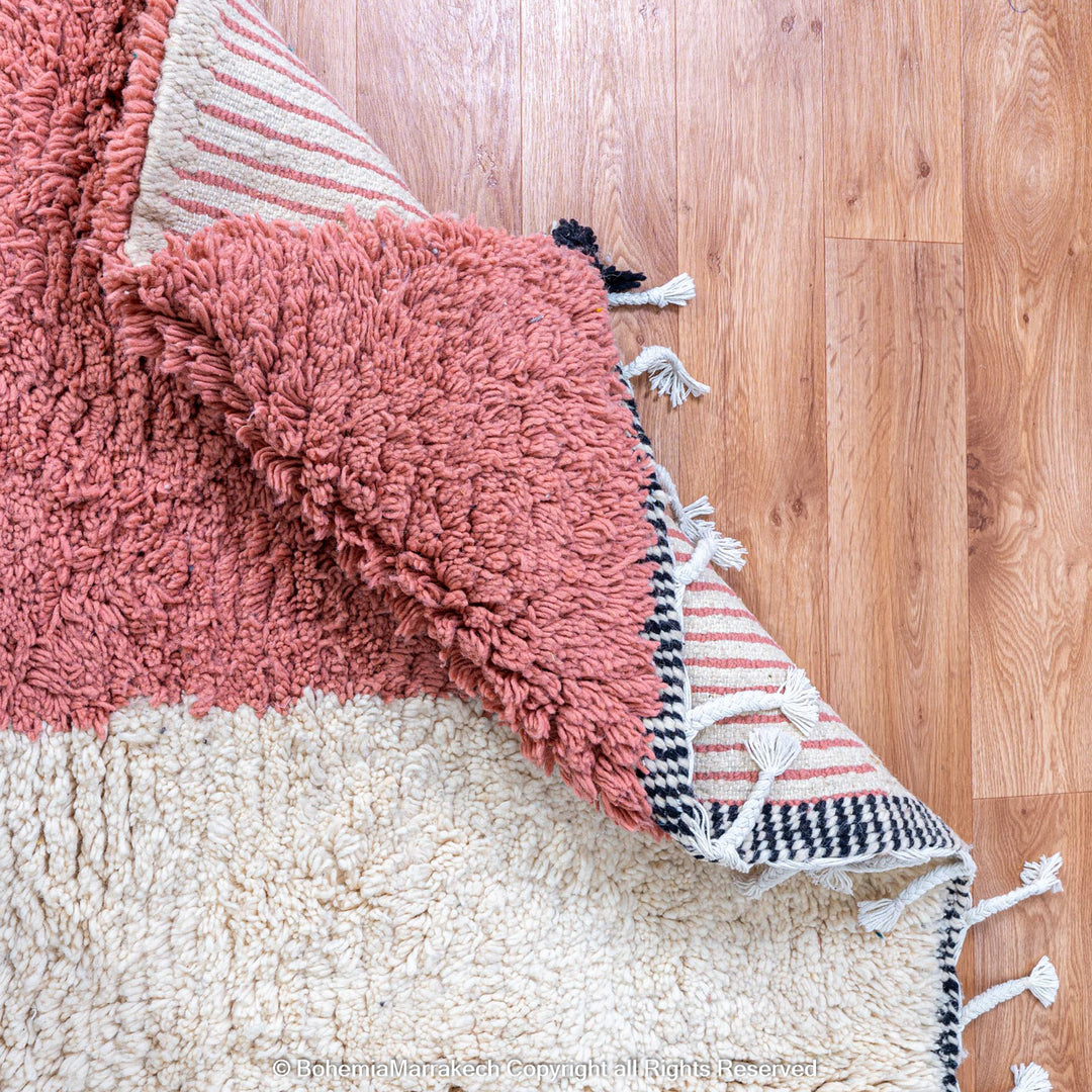 Colorful Moroccan Beni Ourain rug with diamond patterns, handmade from wool by Berber women