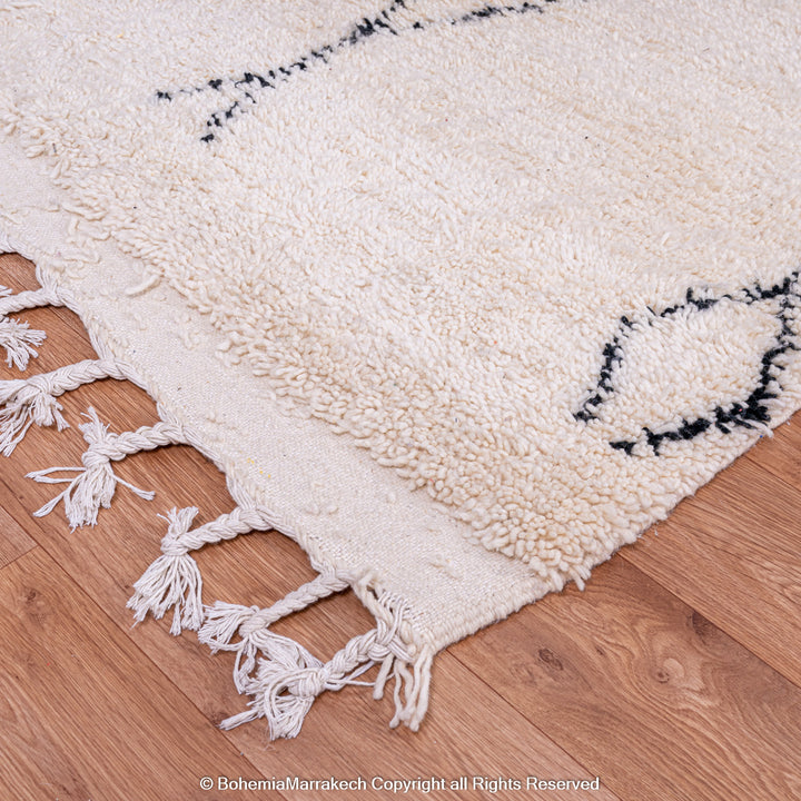 Handmade Beni Ourain Moroccan rug with black diamond pattern on ivory wool