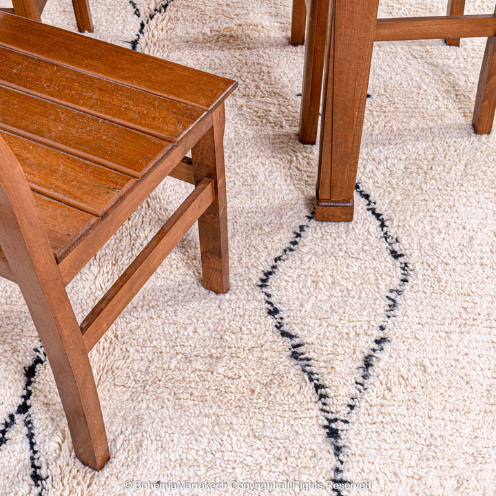 Handmade Beni Ourain Moroccan rug with black diamond pattern on ivory wool