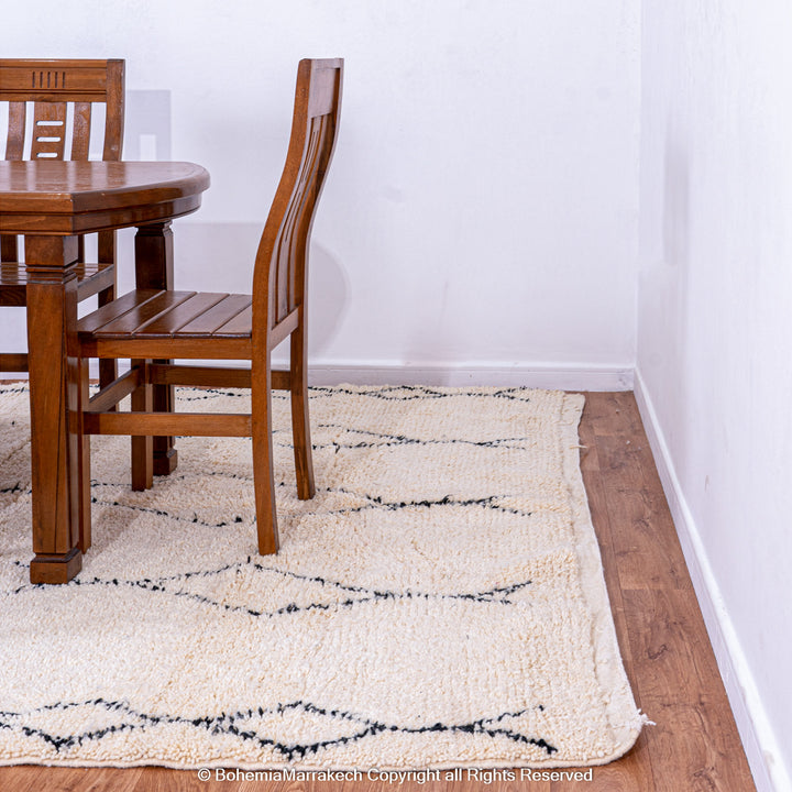 Handmade Beni Ourain Moroccan rug with black diamond pattern on ivory wool
