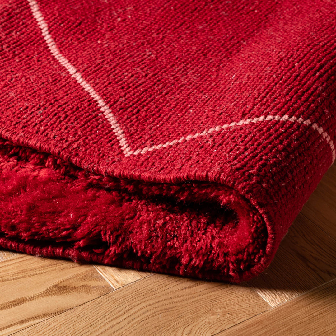 Red Beni Mrirt Moroccan wool rug with white diamond lattice, handmade by artisans from Morocco. Perfect for cozy home decor.
