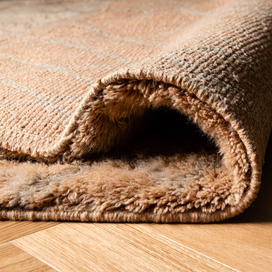 Close-up of a Solid Camel Beni Mrirt Moroccan rug made of natural wool, showcasing plush texture and camel tones for cozy interiors.
