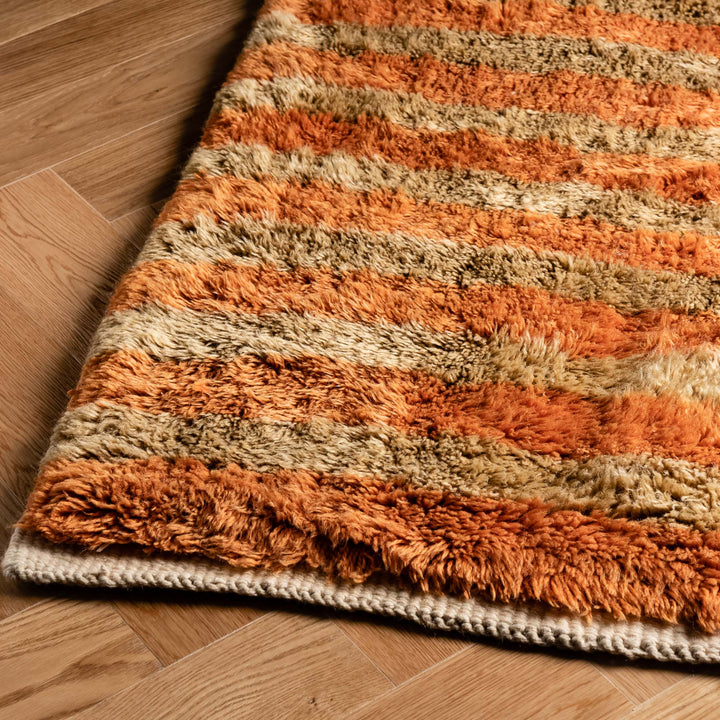 Striped Beni Mrirt Moroccan rug in orange and beige, handwoven wool with Berber design, ideal for modern spaces.