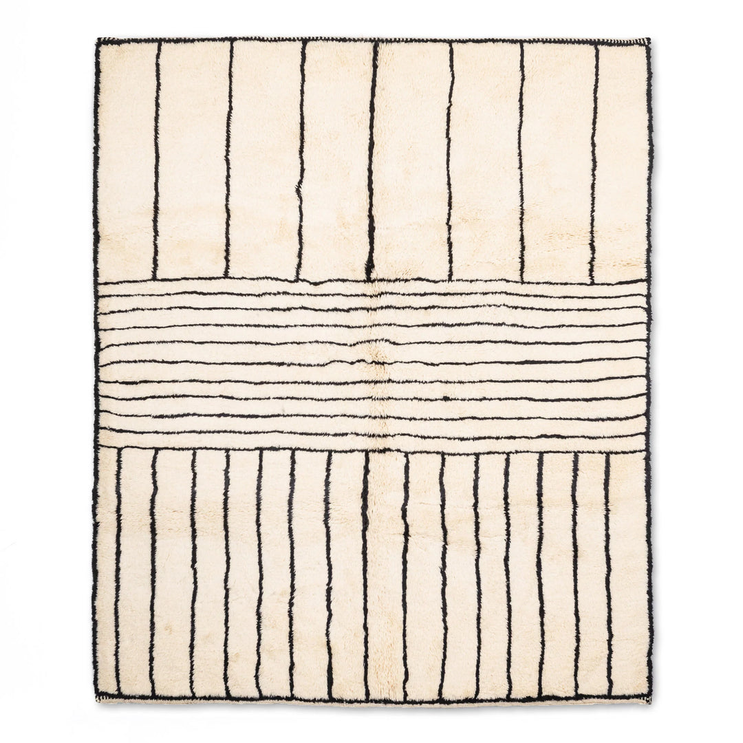Handmade Moroccan wool rug with black stripes on ivory, 8x10 area rug, traditional Berber design, modern style.