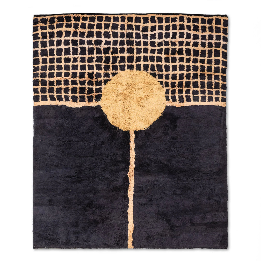 Handmade Moroccan wool rug with golden sun over grid pattern on black background, crafted by Berber artisans. Moroccan rug for modern spaces.