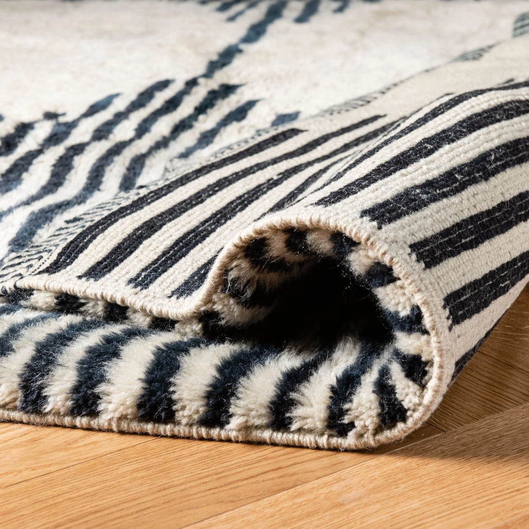 Wavy Striped Moroccan Wool Rug - Handmade Boho Style, black and ivory stripes, plush texture, Moroccan Berber tradition