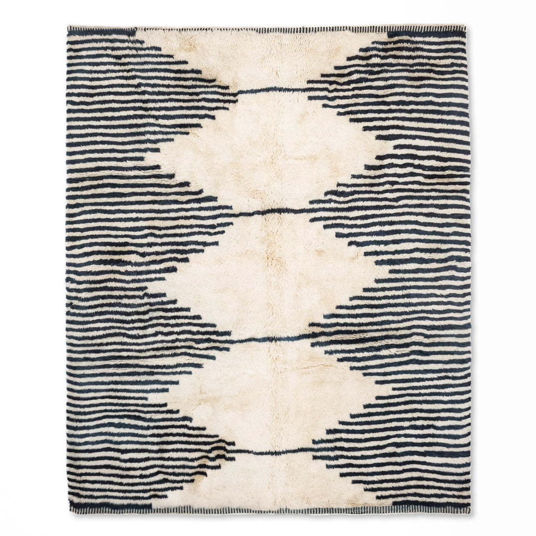 Wavy Striped Moroccan Wool Rug, black and ivory, handcrafted boho style, perfect for mid-century or minimalist decor. Available on Etsy.