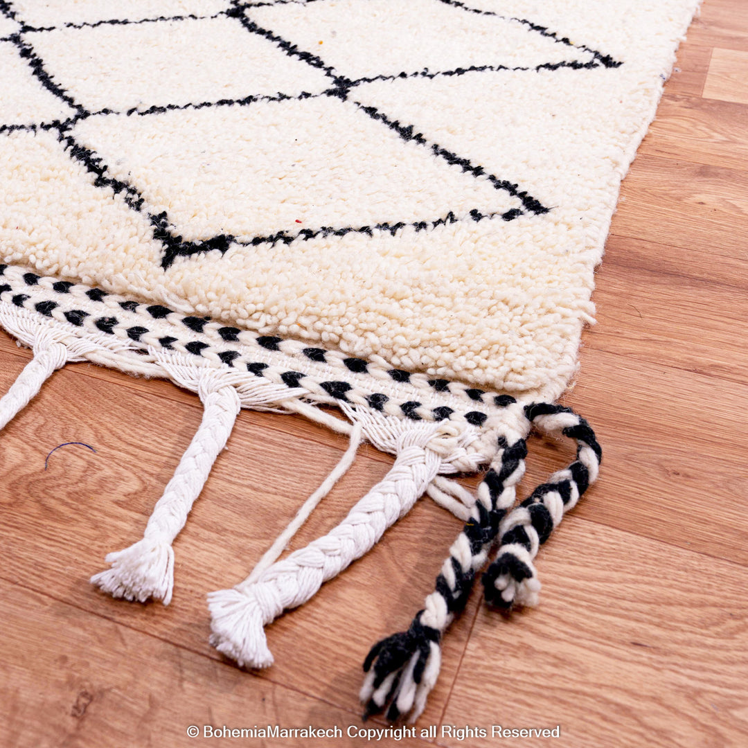 Handwoven Beni Ourain Moroccan rug in black and white wool with geometric diamond pattern