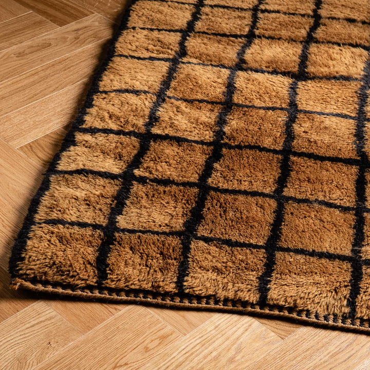 Plush Moroccan runner rug with geometric pattern on wooden floor