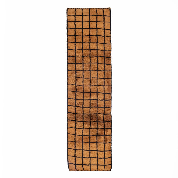 Handwoven Moroccan runner rug with a geometric grid pattern, crafted from natural wool, available for custom orders and hallway decor.